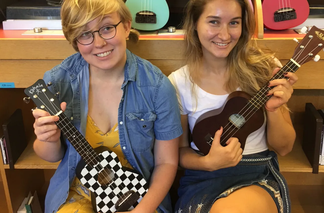 Students with ukuleles for loan in Josten Library
