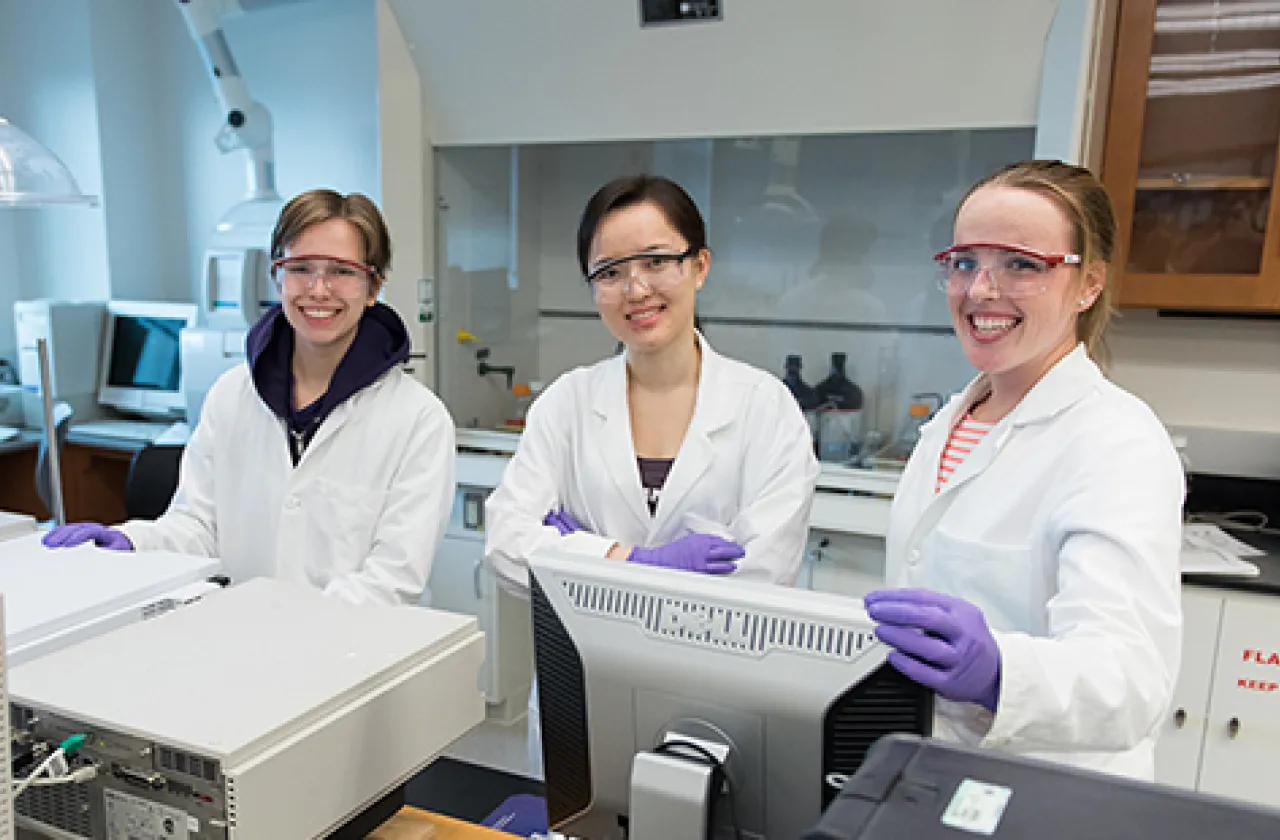 Three students in a lab in Ford Hall