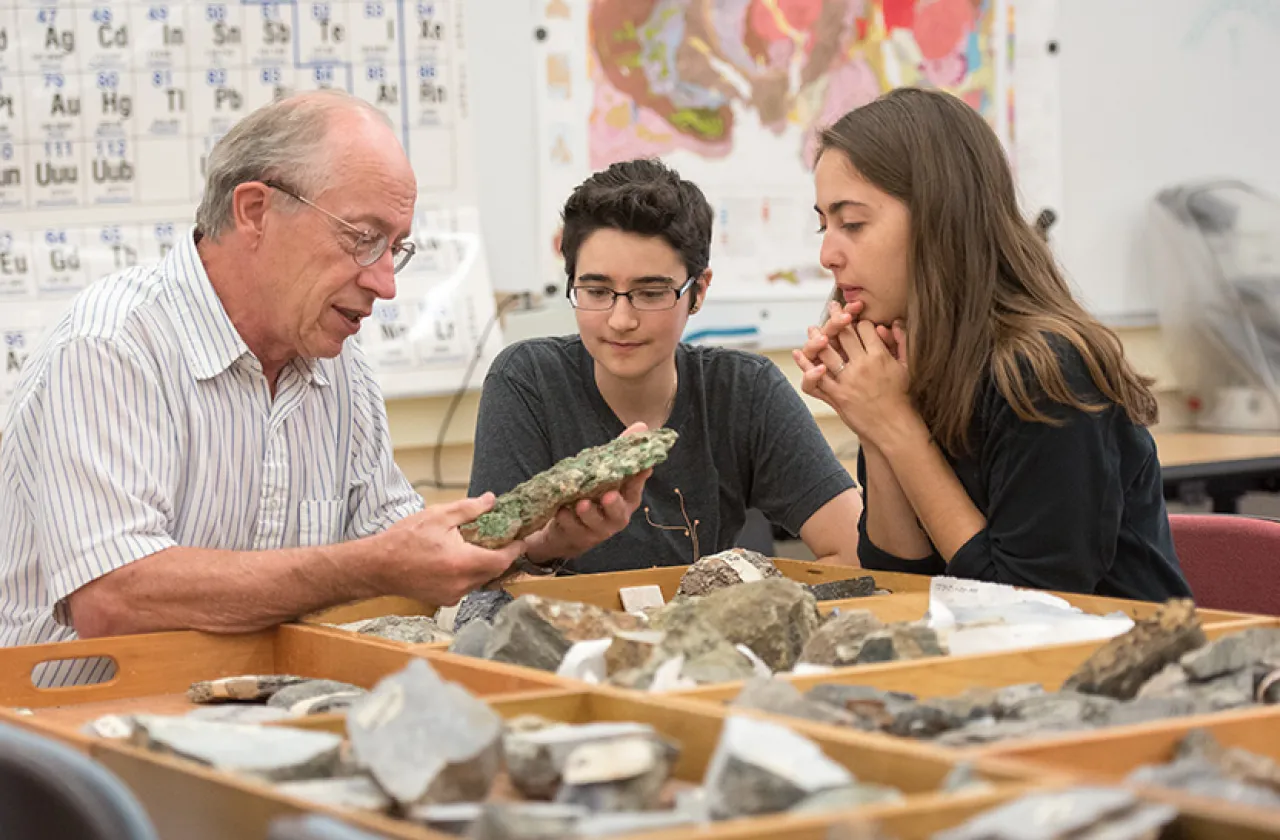 Professor John Brady with two students