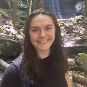 Sophia Eastman ’26 standing in front of a waterfall
