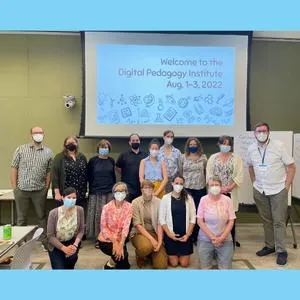 faculty and staff gathering in a classroom