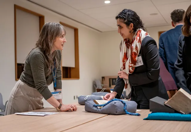Erin McGuirl speaking with conference goer