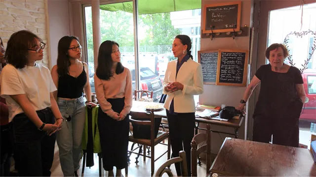 Anita Wien and Lois Grjebine speak with participants in the Smith in Paris program