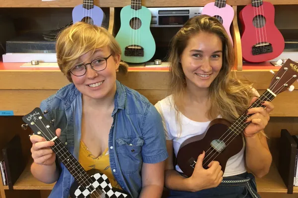 Students with ukuleles for loan in Josten Library