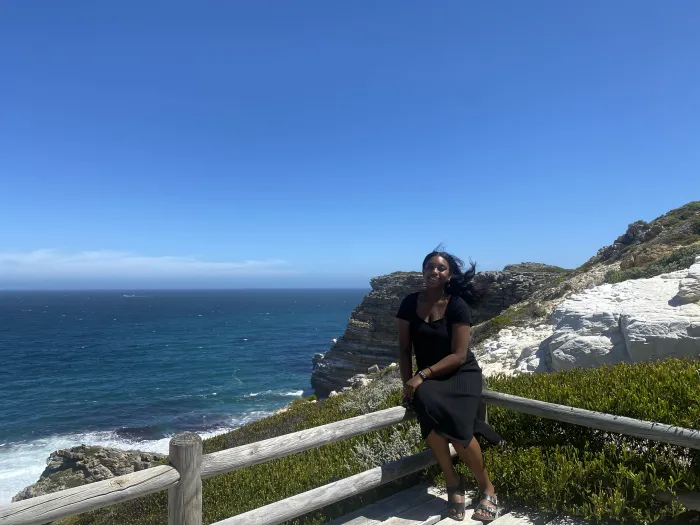 Sa’Mya Wilson posing by the ocean in Cape Town, South Africa