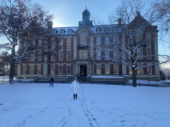 Sa’Mya Wilson standing in the snow in front of Seelye Hall