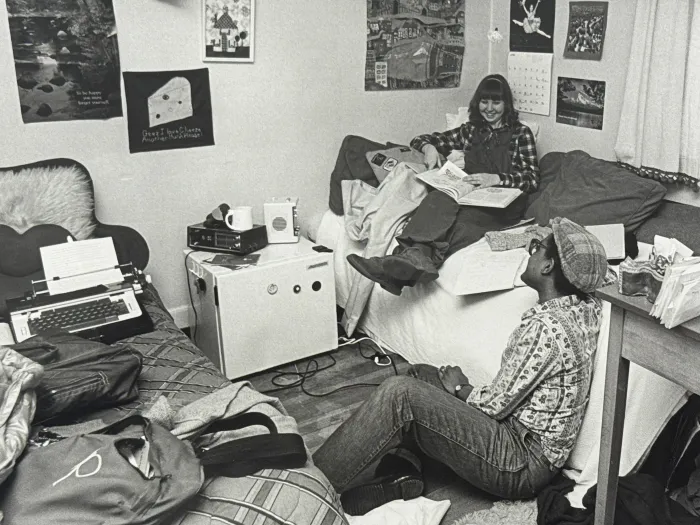 Students relaxing in dorm room on move in day