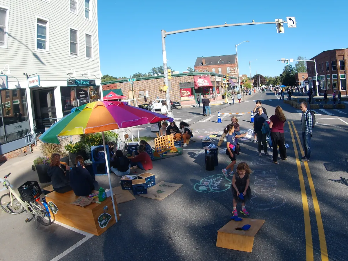 A ParKit set up in the street, a scene filled with people and games