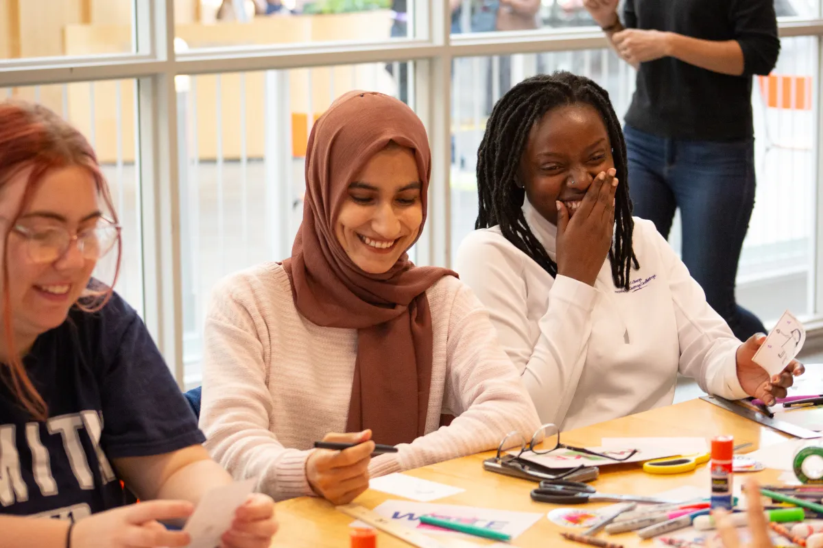 Two Smith students laugh during a workshop at ZineFest