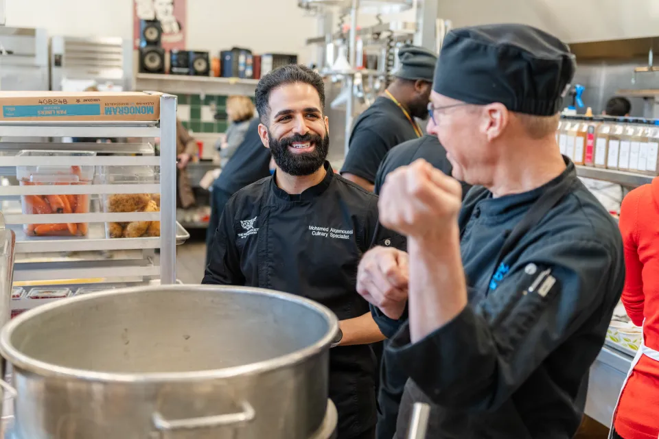 Chef Mohamed Alqamoussi of the Humane Society talks to Smith's Tim Zima in the Chase-Duckett kitchen during a training