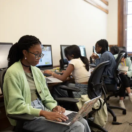 A student on a laptop.