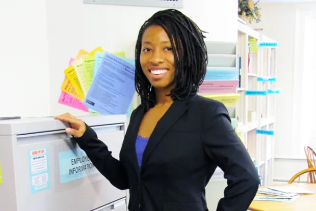 Photo of a student posing in a suit